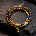 Balance & Prosperity- Gold Flow Agarwood Bracelet with Dzi Charm
