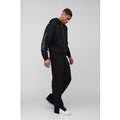 Tuta sportiva squadrata oversize Official Man con zip e cappuccio, Nero