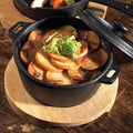 Utopia Cast Iron Round Casserole Dish with Utopia Round Acacia Wooden Board